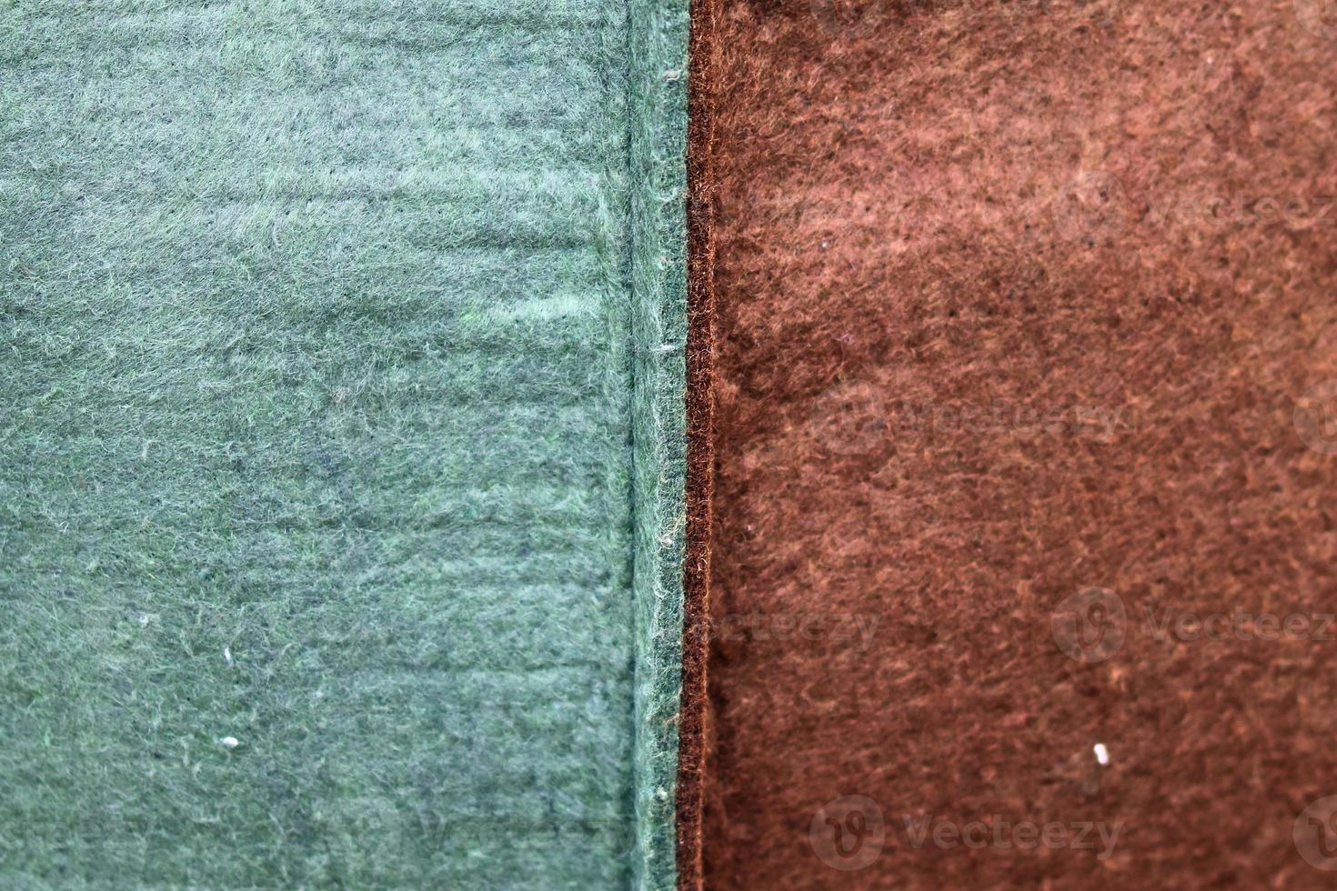 Detailed close up view on samples of cloth and fabrics in different colors found at a fabrics market photo