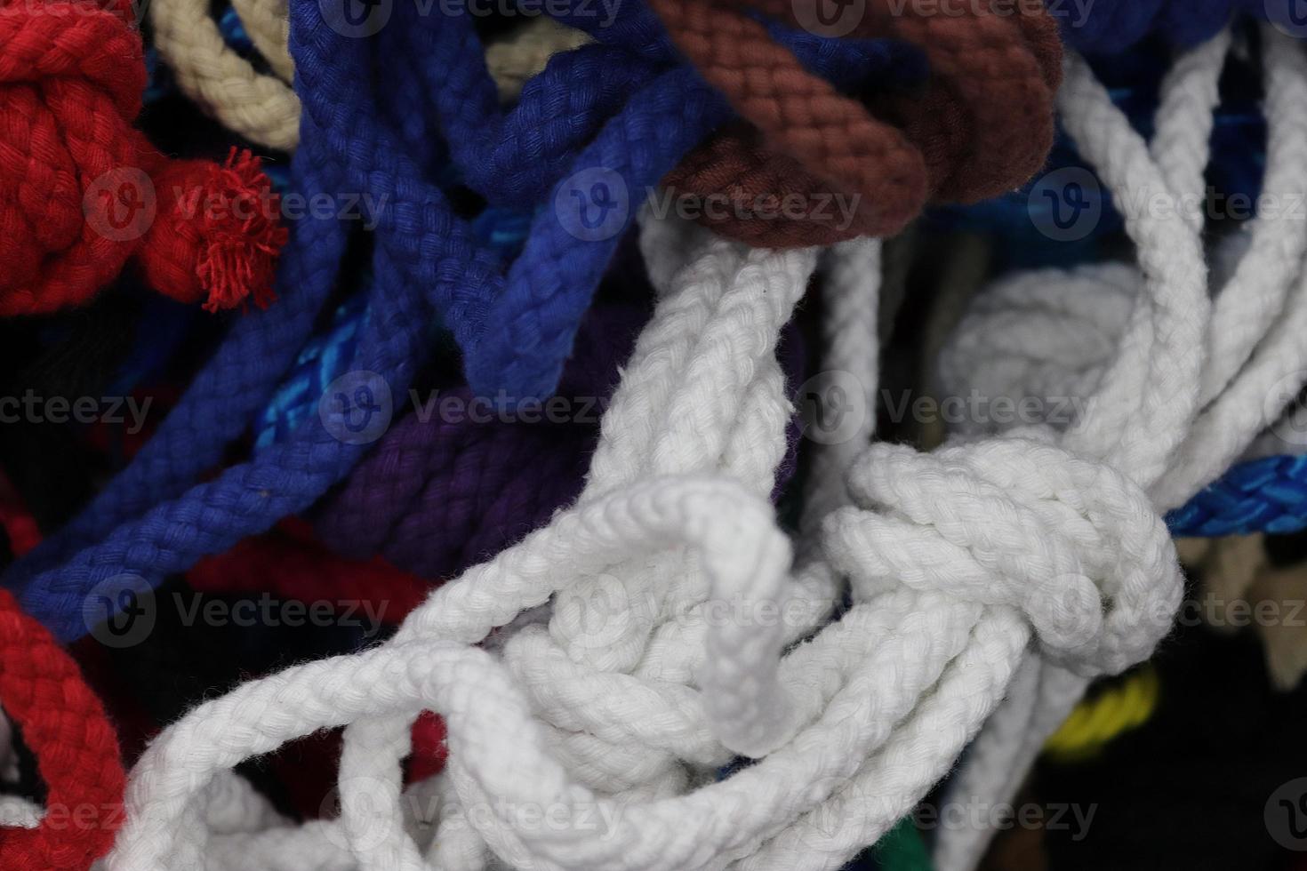 Detailed close up view on samples of cloth and fabrics in different colors found at a fabrics market photo