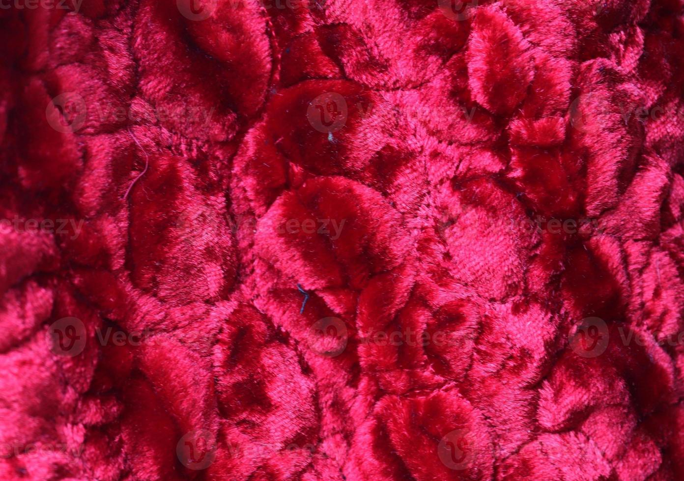 Detailed close up view on samples of cloth and fabrics in different colors found at a fabrics market photo
