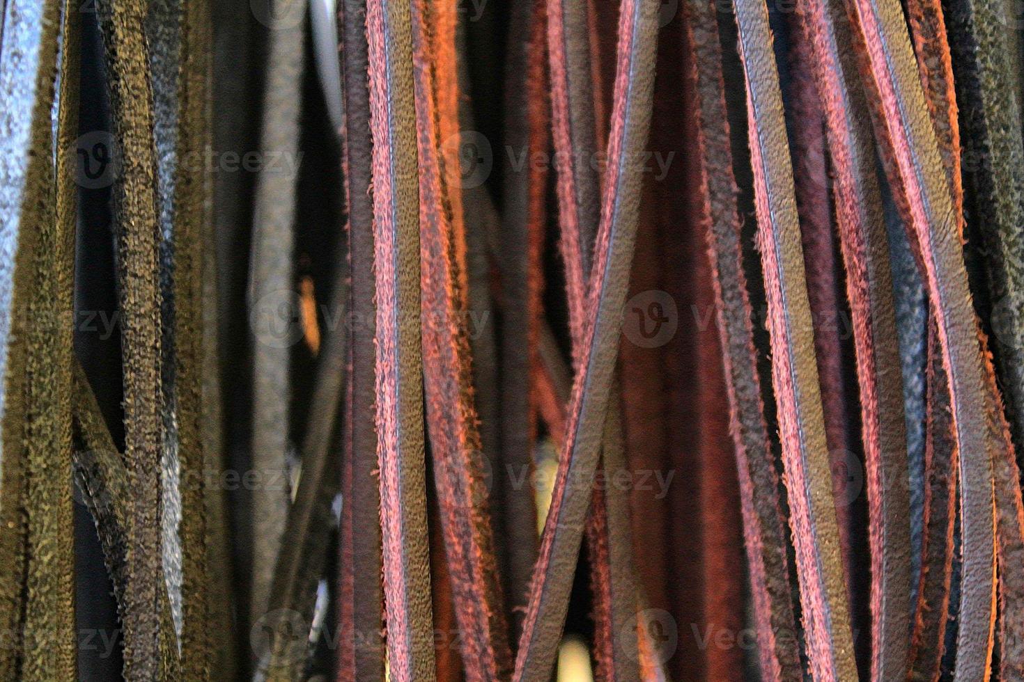 Detailed close up view on samples of cloth and fabrics in different colors found at a fabrics market photo