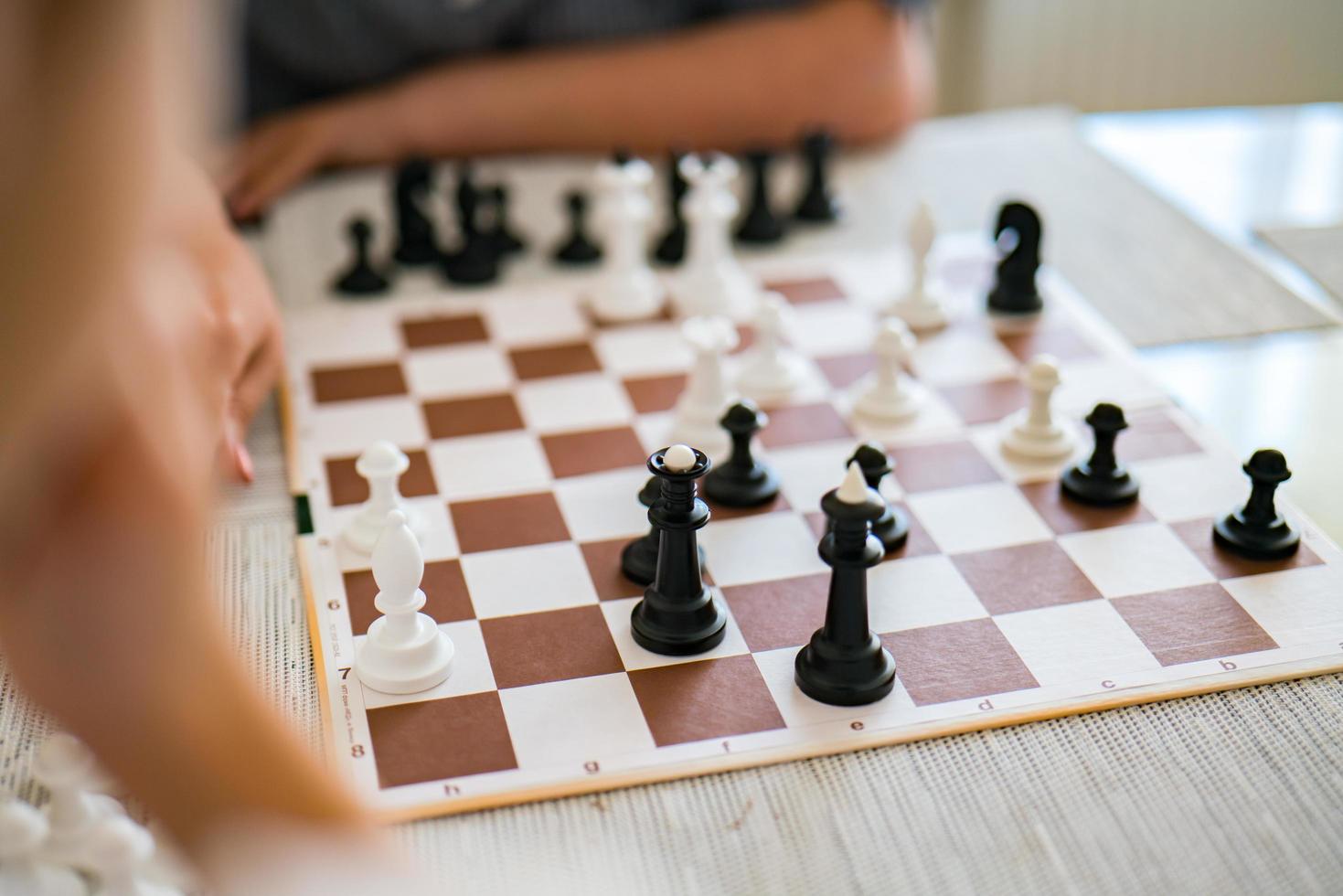 Chess pieces set on a chessboard. photo