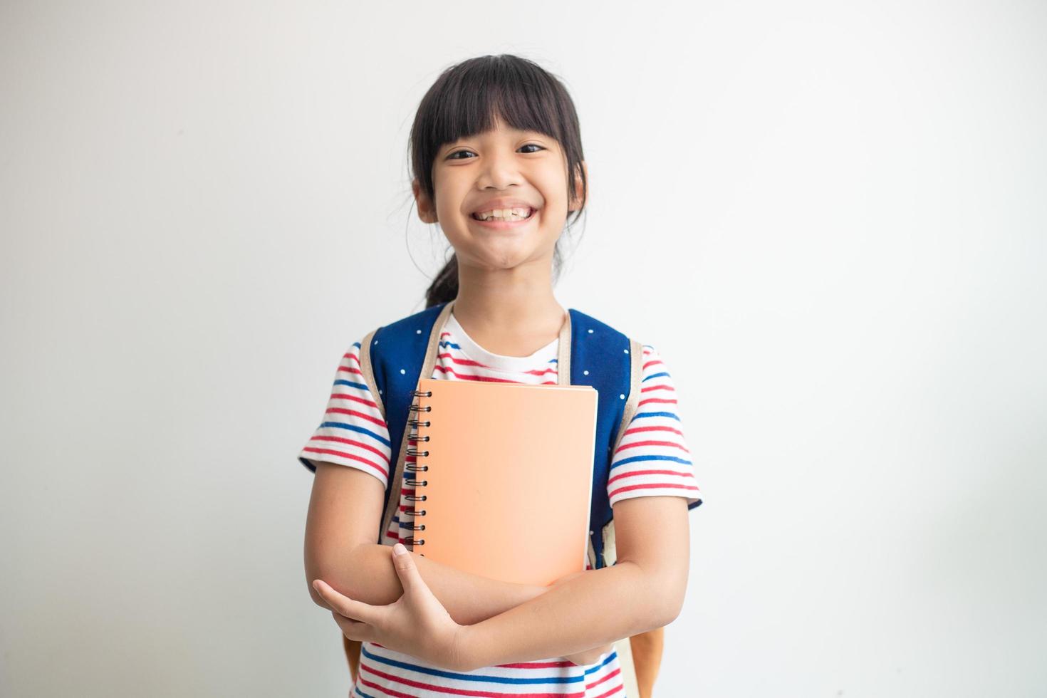 Asian student girl holding books photo