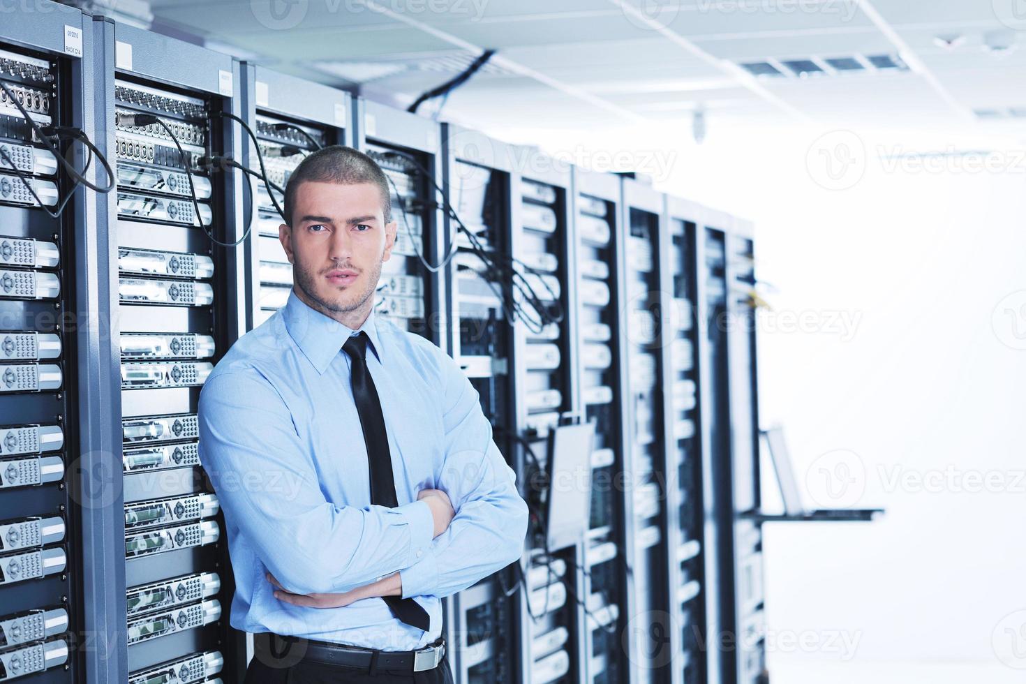 young it engeneer in datacenter server room photo