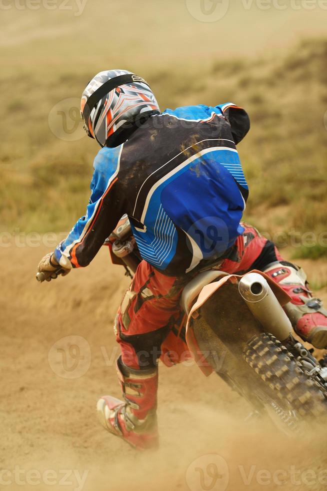 Riding a motocross bike photo