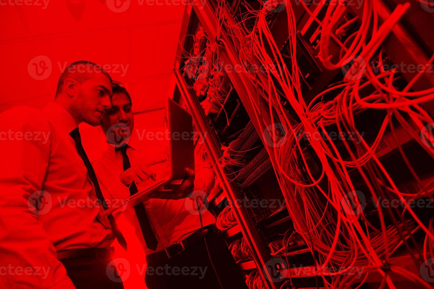 it engineers in network server room photo