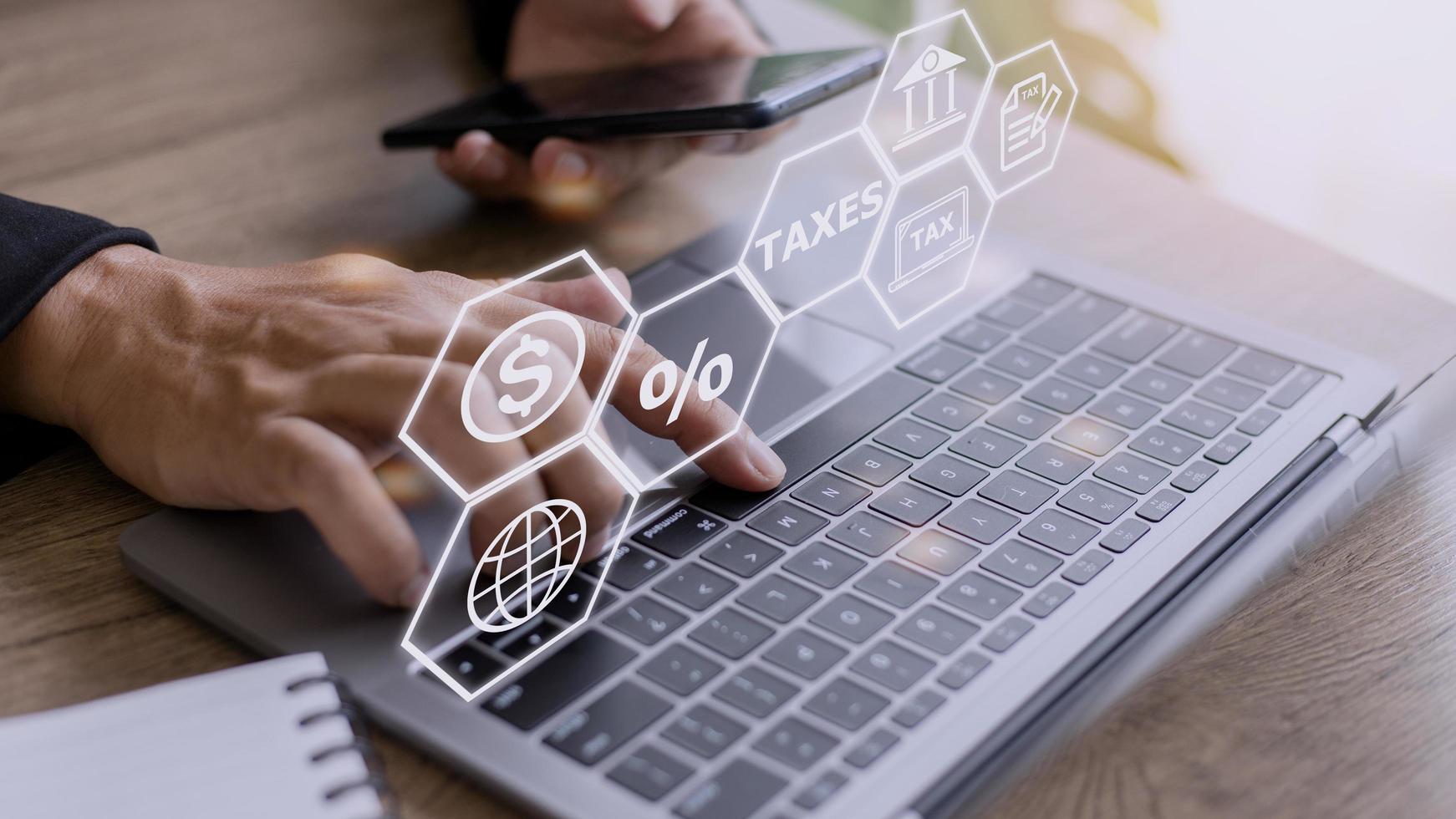Busines using a computer to complete Individual income tax return form online for tax payment. Government, state taxes. Data analysis, paperwork, financial research, report. Calculation tax return. photo