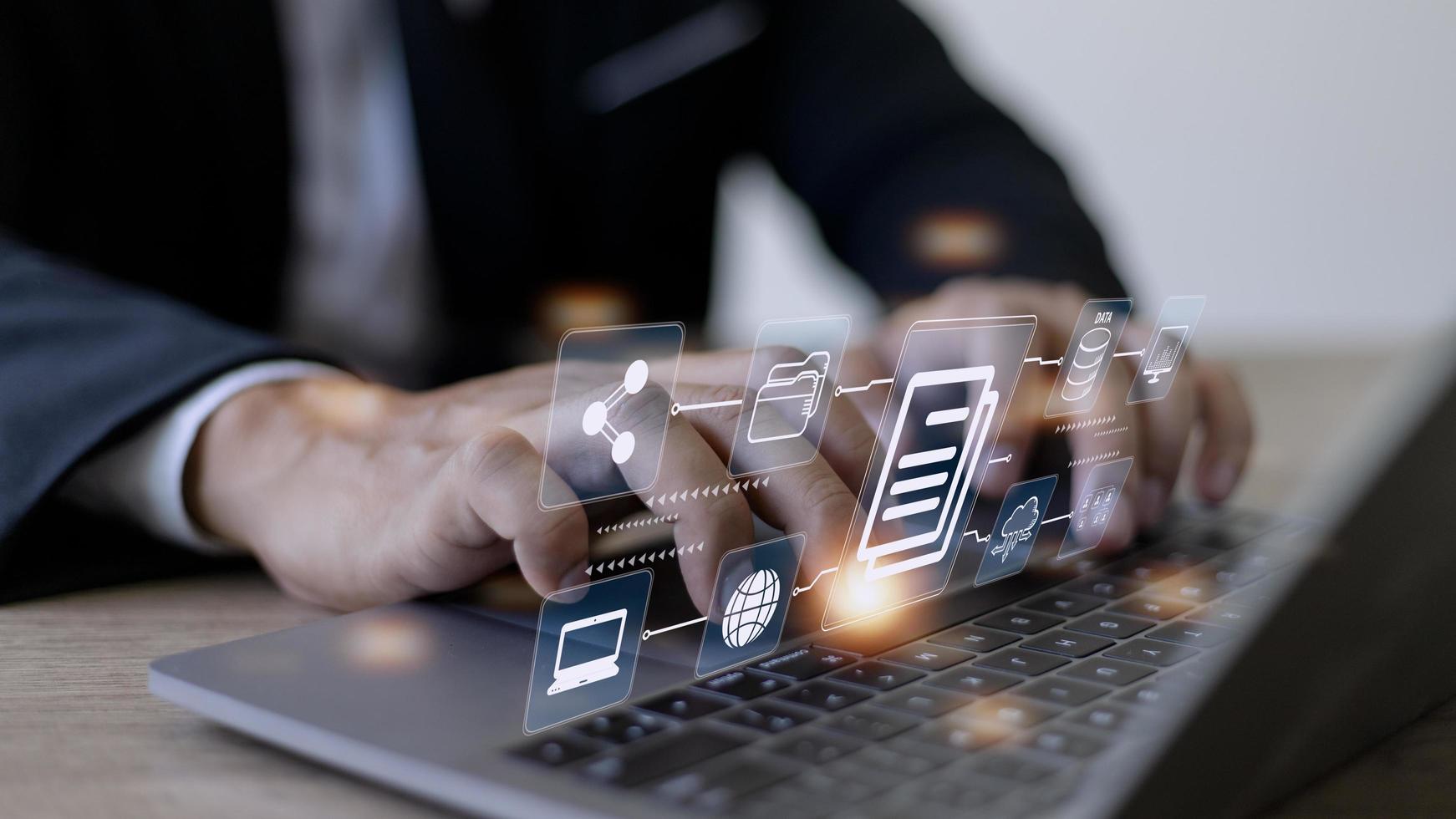 Businessman using a computer to document management concept, online documentation database and digital file storage system software, records keeping, database technology, file access, doc sharing. photo