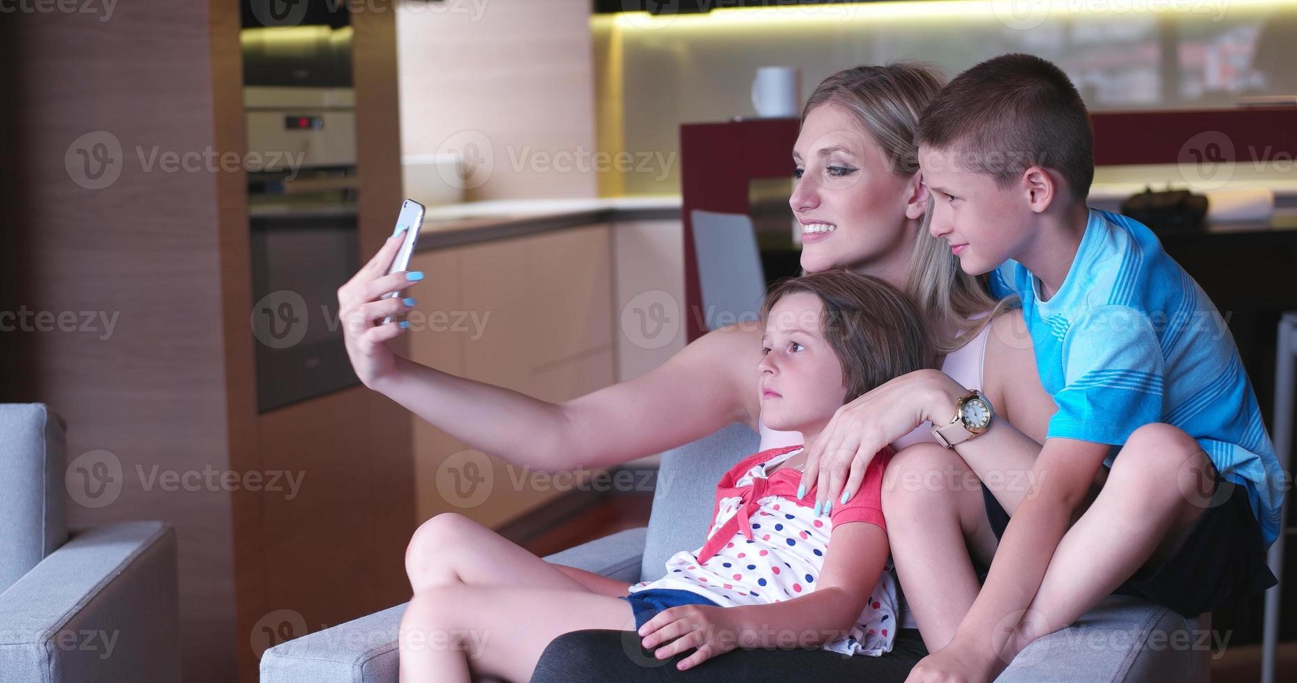 Family relaxing in living room photo