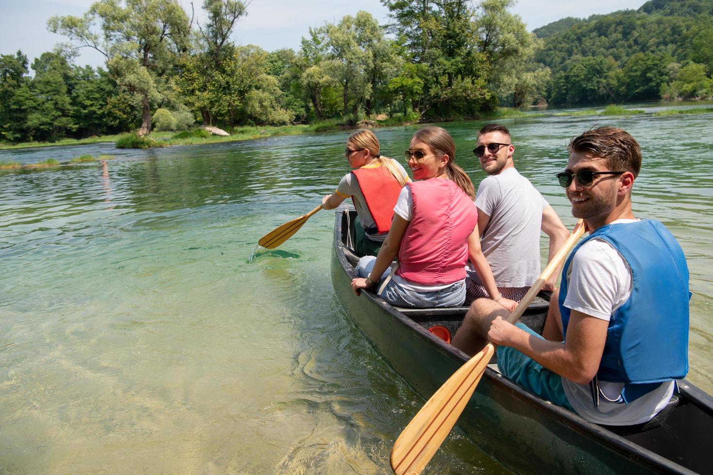 Friends canoeing outside photo