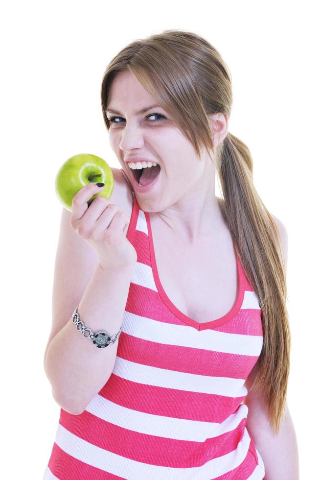 happy  young  woman eat green apple isolated  on white photo