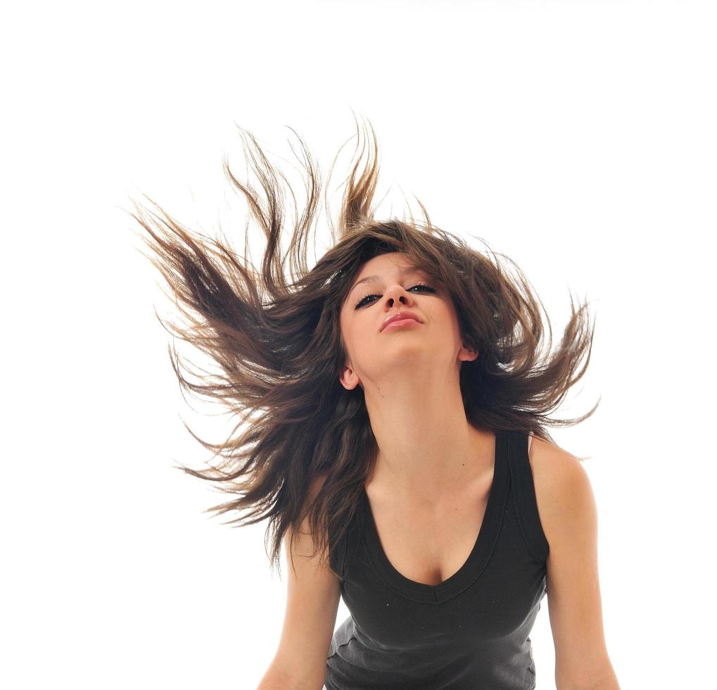 mujer de fiesta aislada con viento en el cabello foto