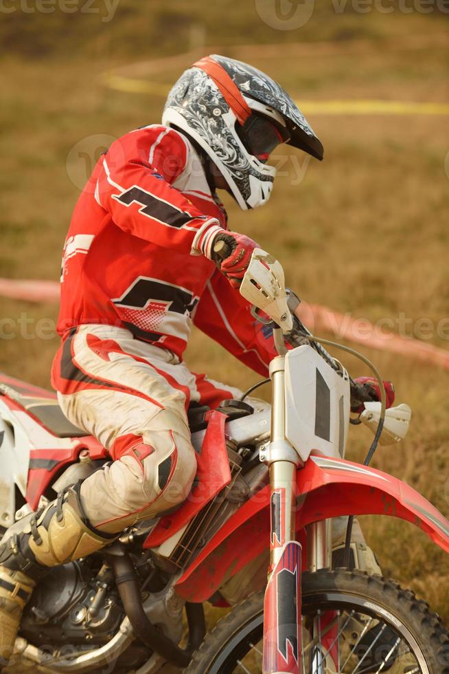 Riding a motocross bike photo