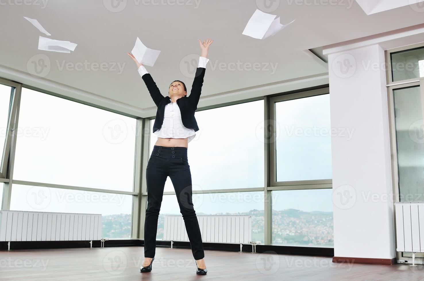 young business woman throw papers in air photo