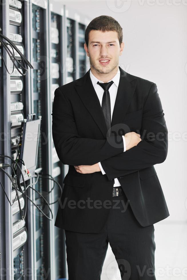 young it engeneer in datacenter server room photo