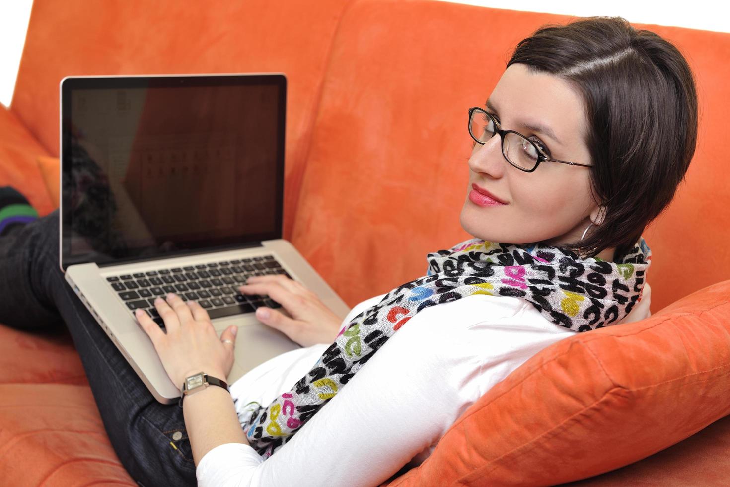 woman using a laptop computer at home photo