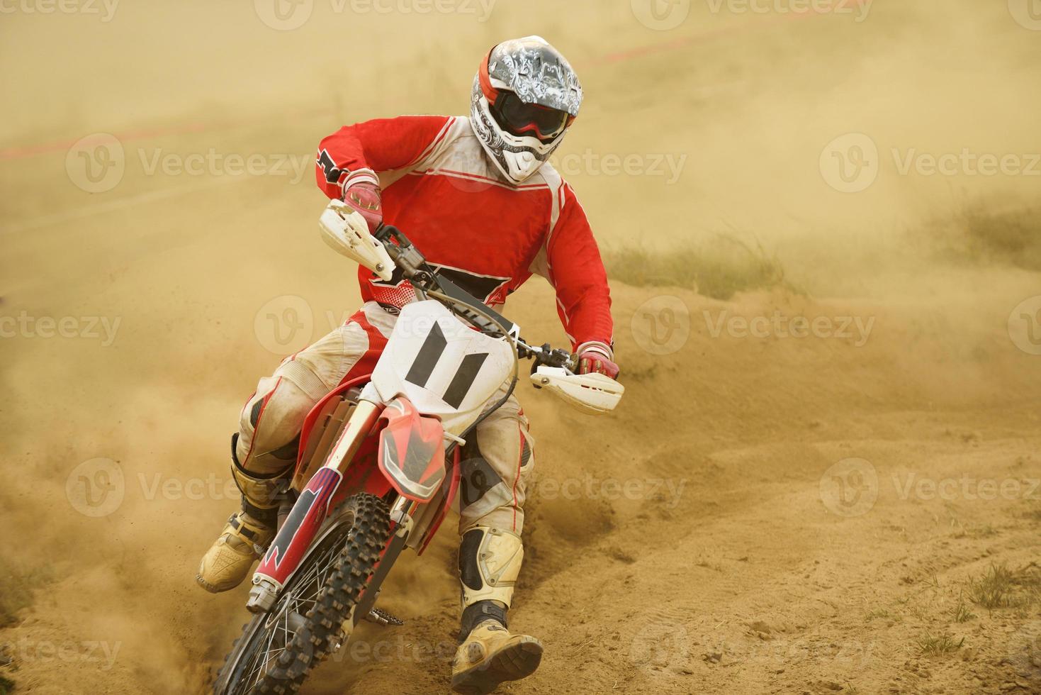 Riding a motocross bike photo