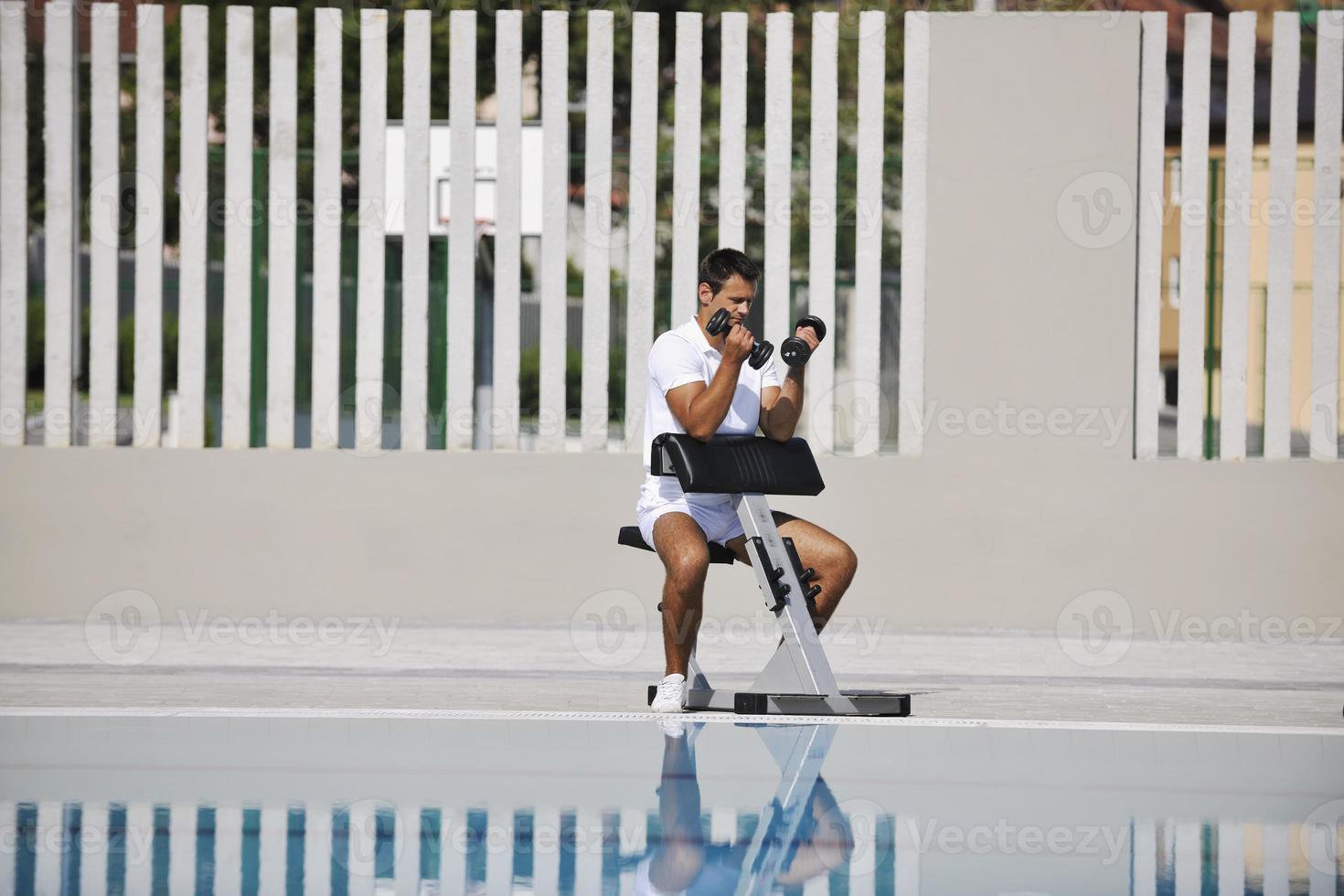 Exercising by pool photo