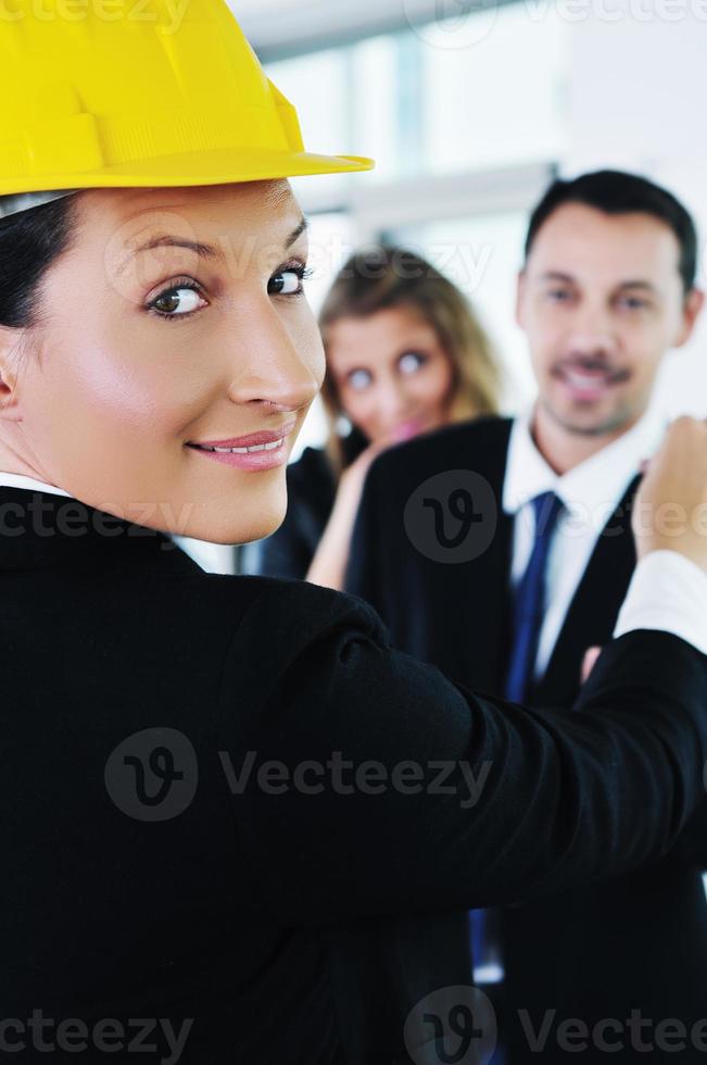 happy young couple buying new home with real estate agent photo