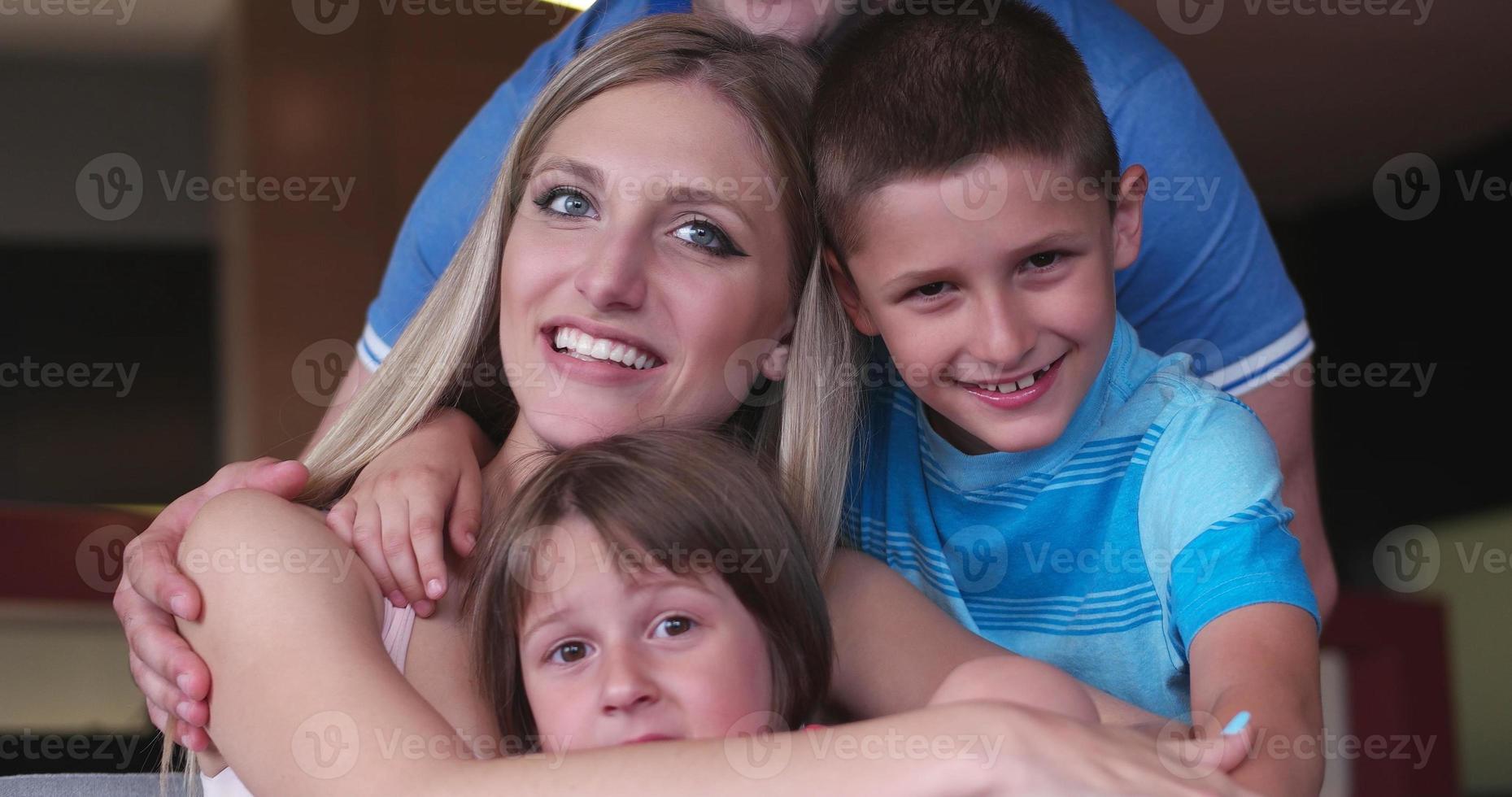 Family relaxing in living room photo