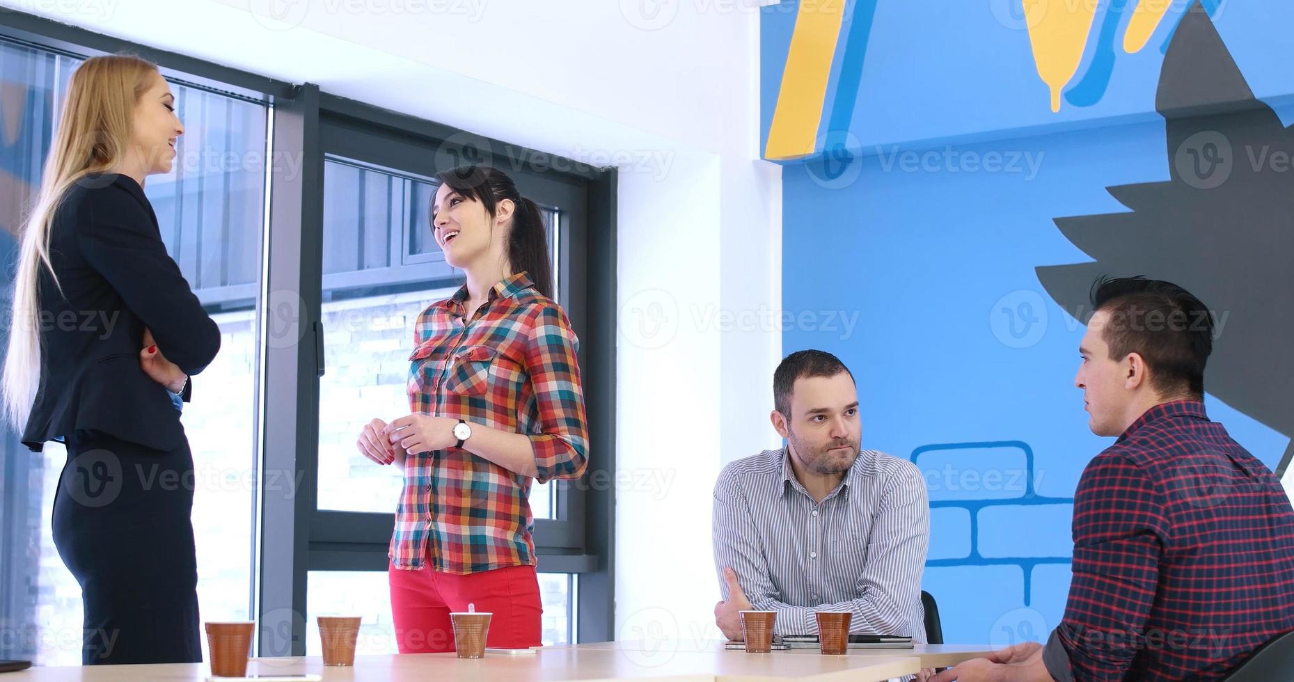Group of young people meeting in startup office photo