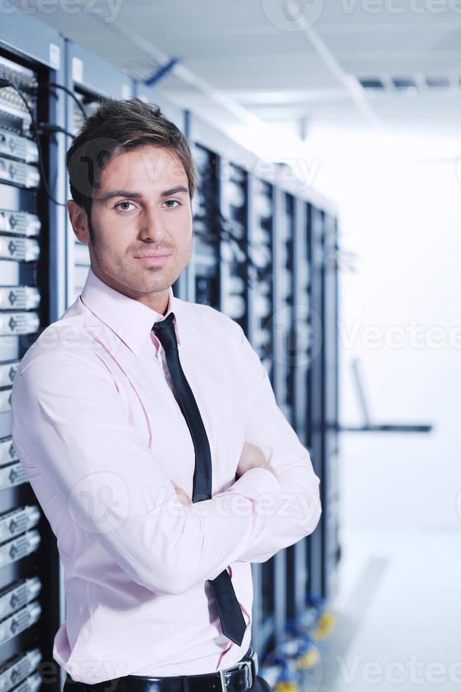 young it engeneer in datacenter server room photo