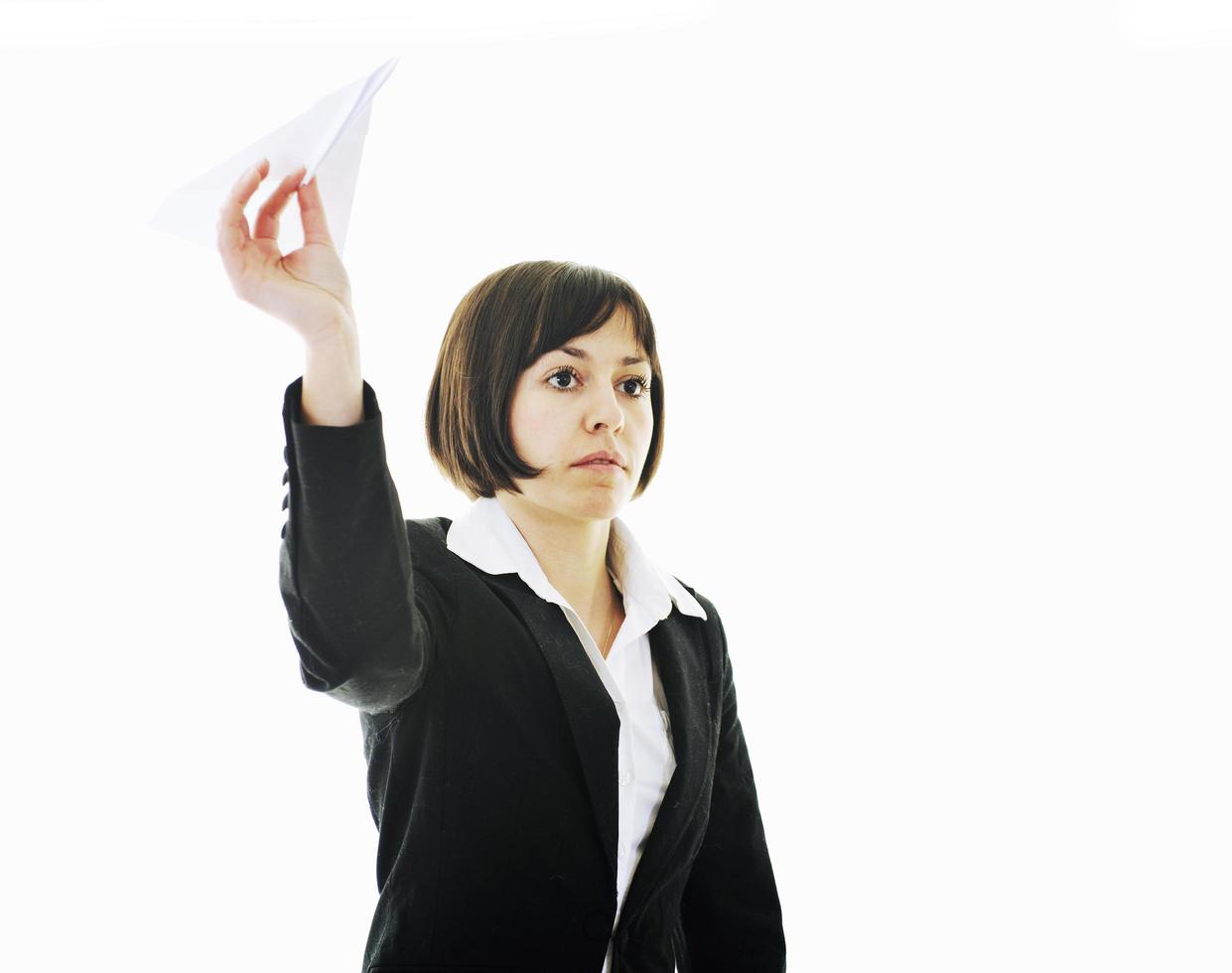 business woman throwing  paper airplane photo