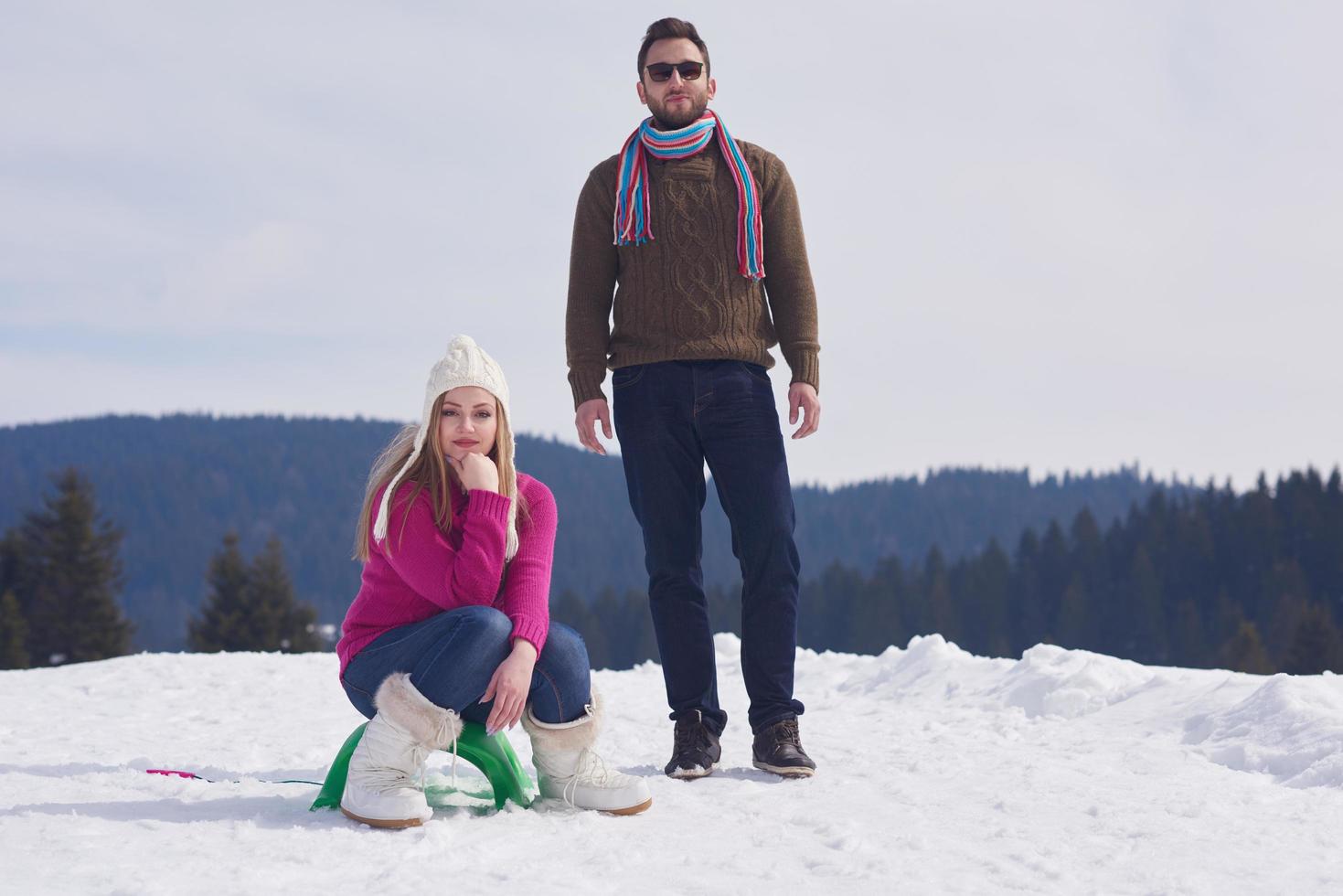 happy young couple having fun on fresh show on winter vacation photo