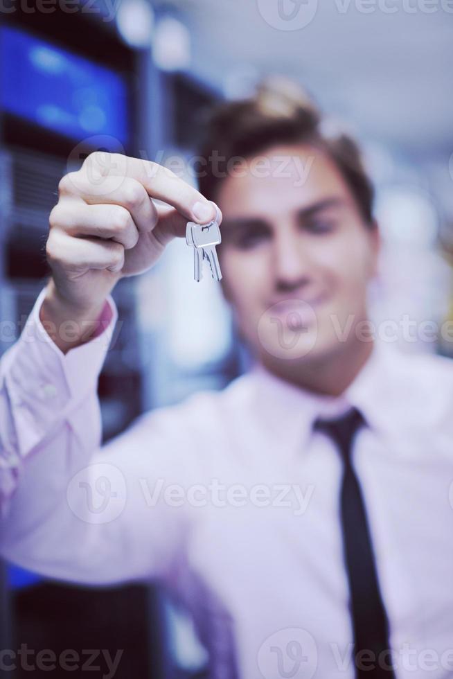 young it engineer in datacenter server room photo