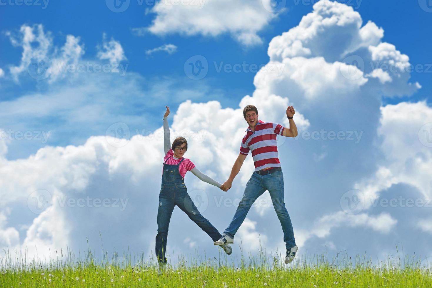 Portrait of romantic young couple smiling together outdoor photo
