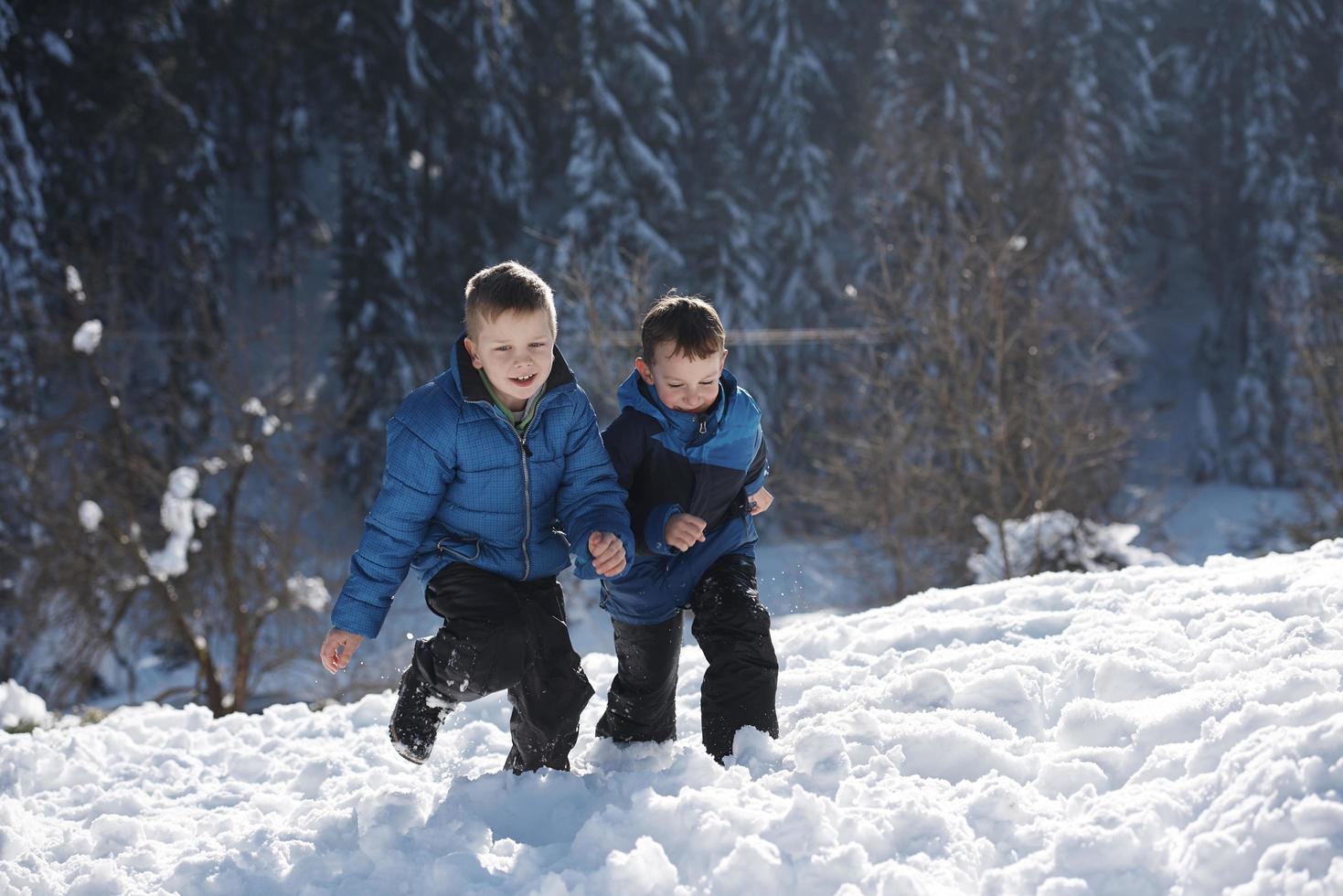 kids playing with  fresh snow photo