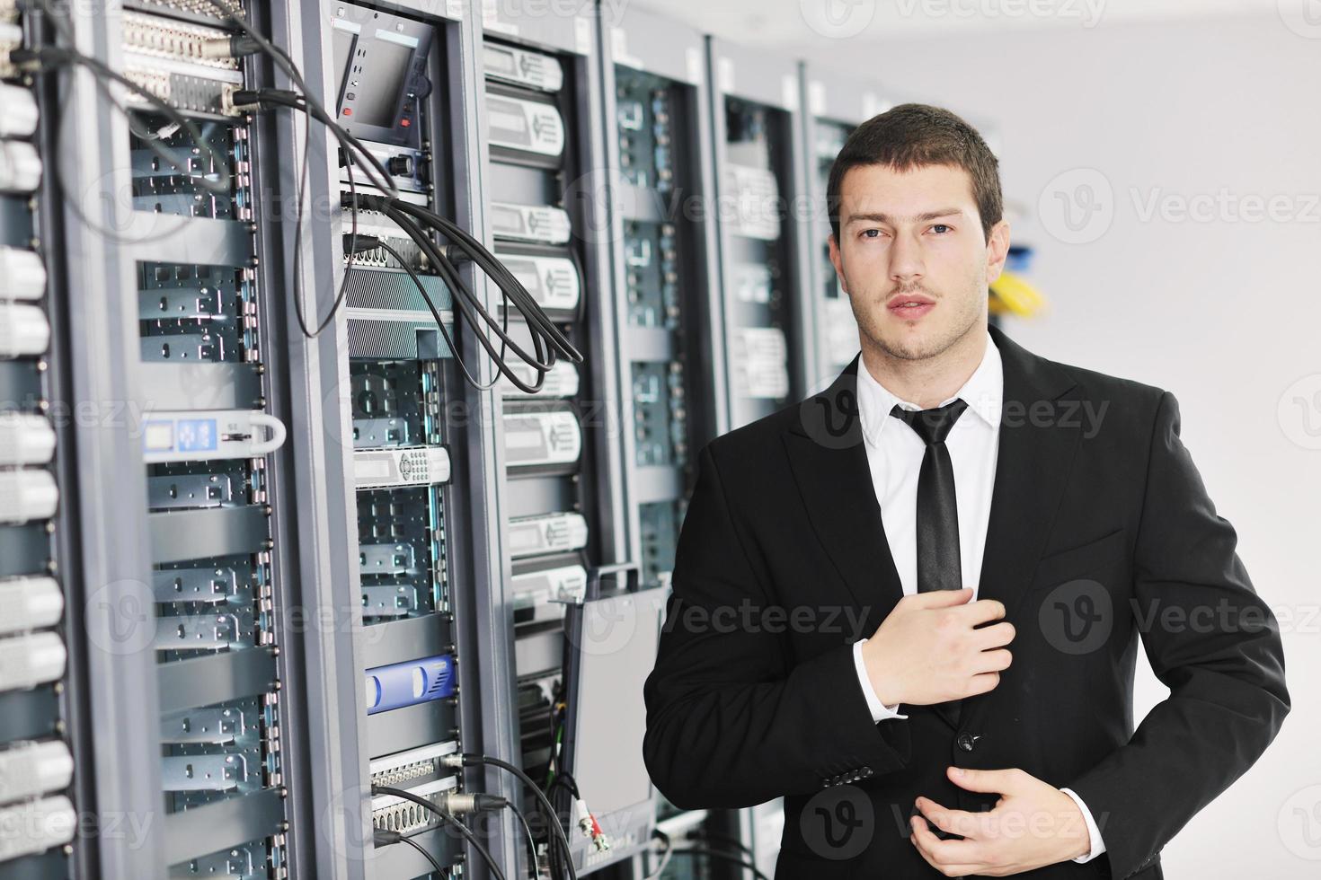 young it engeneer in datacenter server room photo