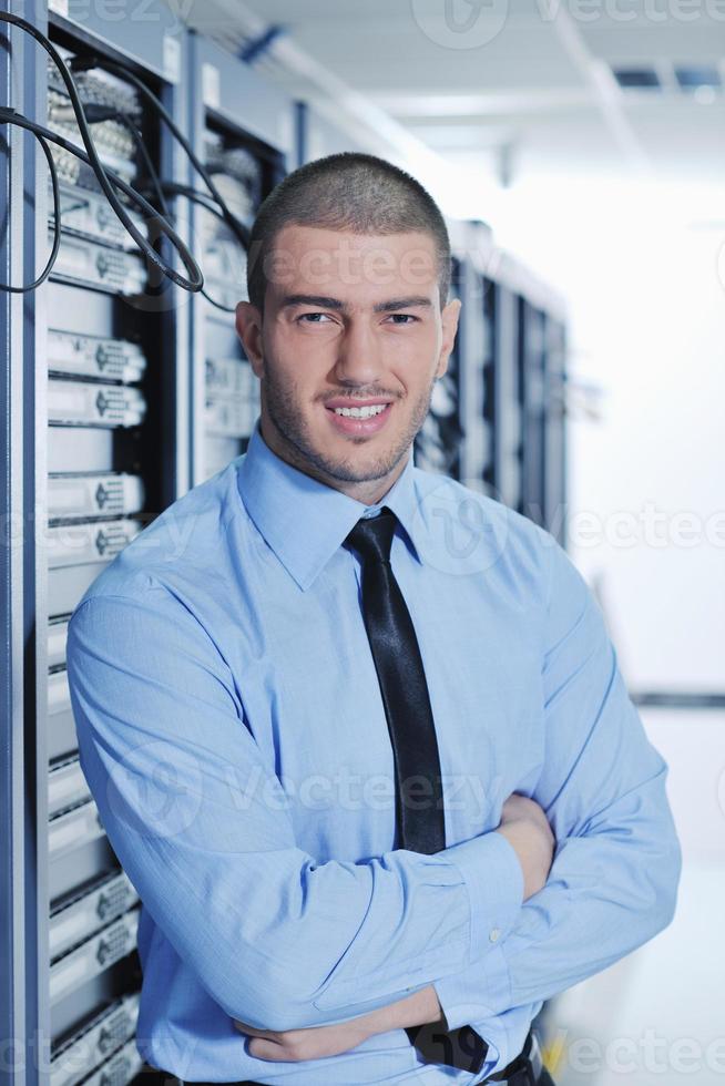 young it engeneer in datacenter server room photo