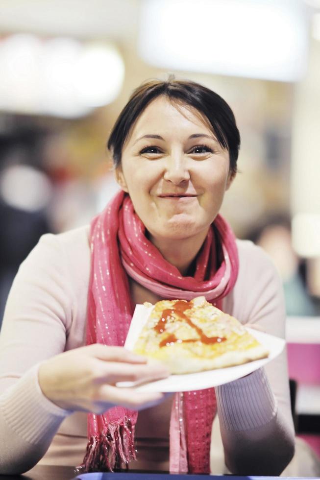 woman eat pizza food at restaurant photo