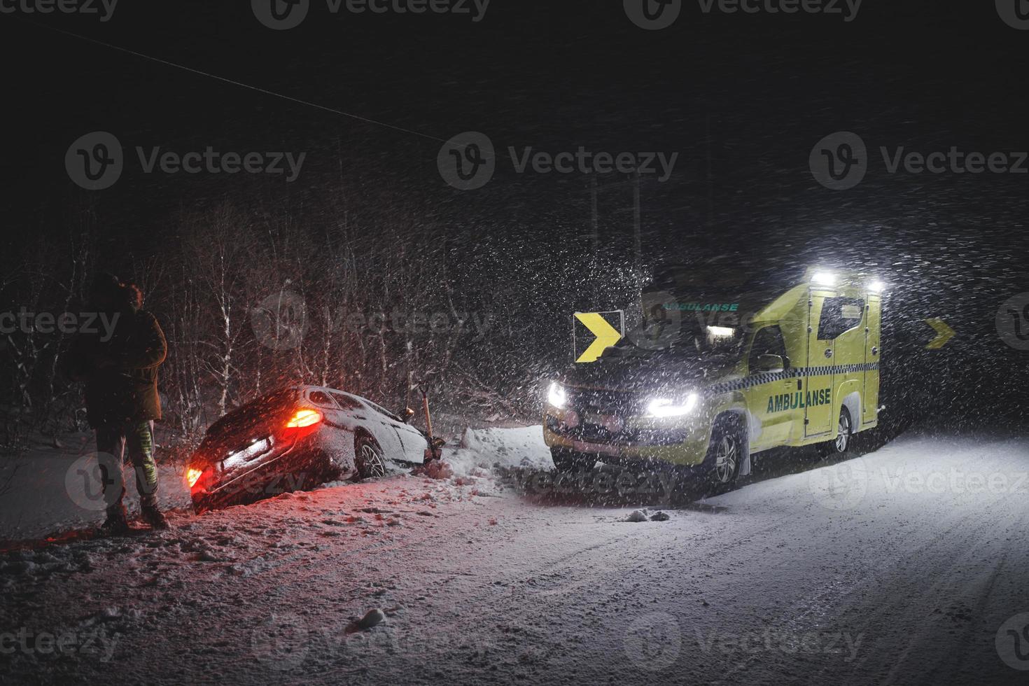 car accident on slippery winter road at night photo