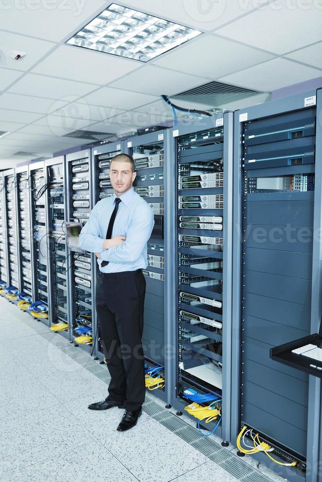 young it engeneer in datacenter server room photo