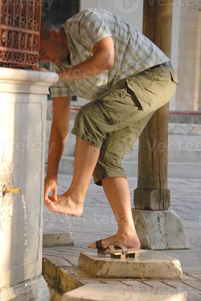 Man washing feet photo