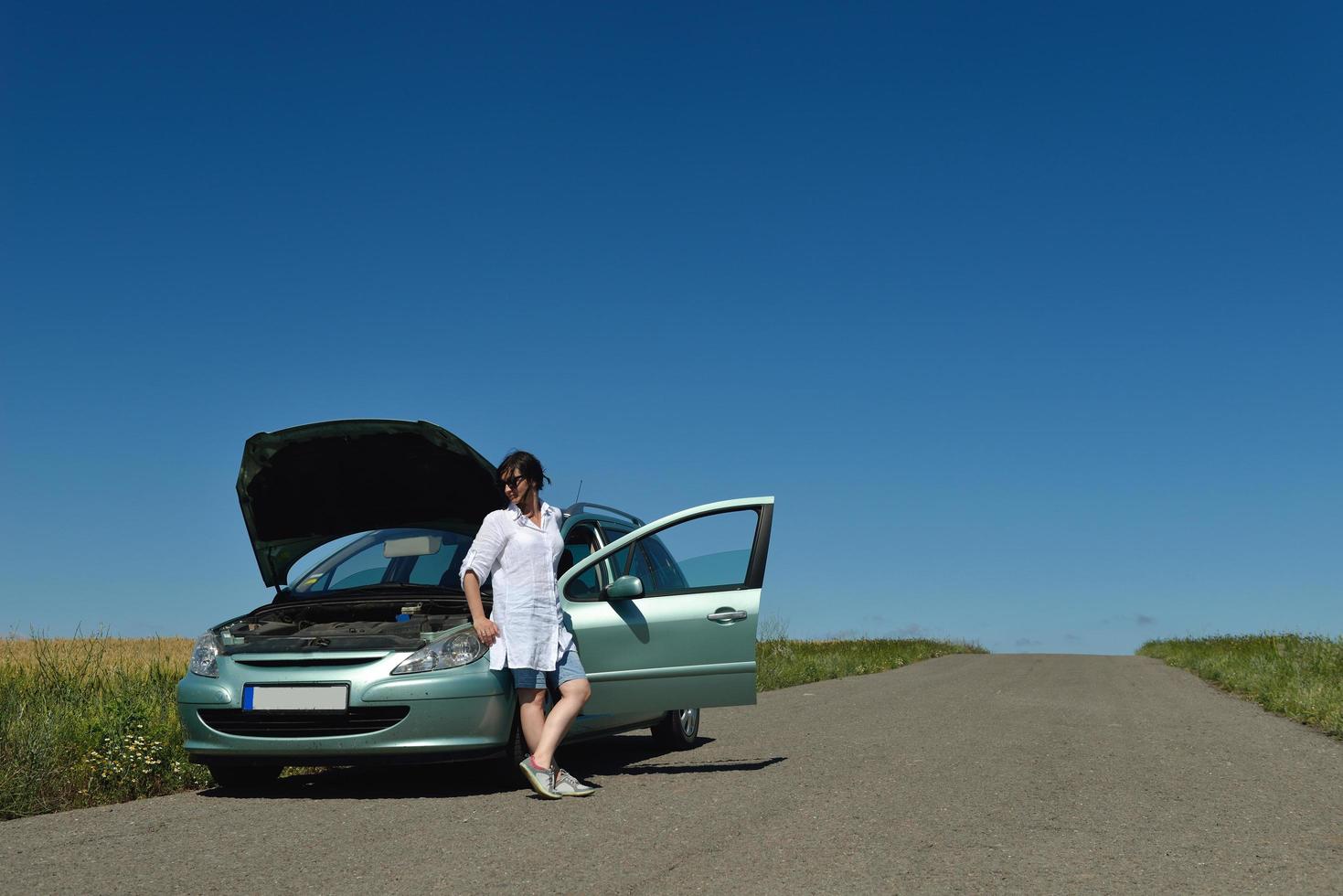 woman with broken car photo