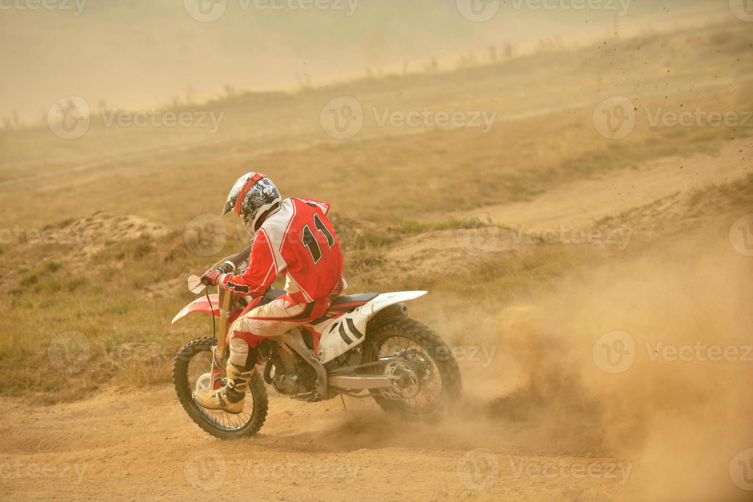 Riding a motocross bike photo