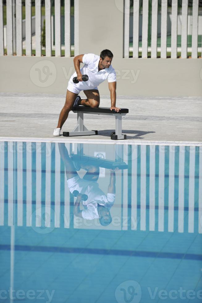 Exercising by pool photo