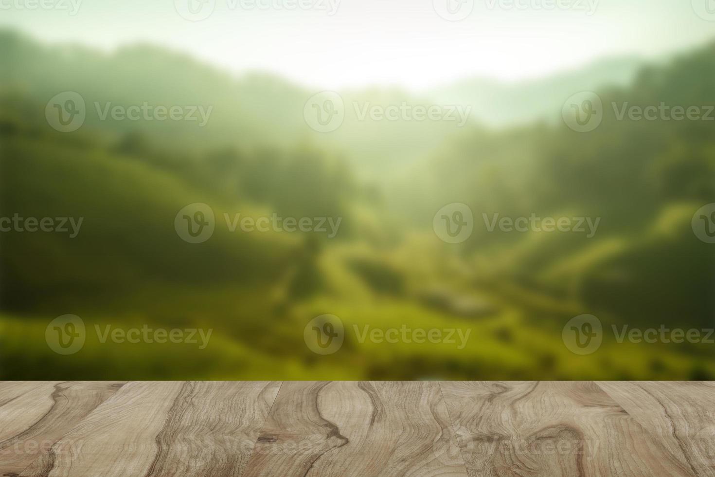 Empty wooden table with view of mountain or wooden desk with plantation nature with bokeh background, copy space for your text photo