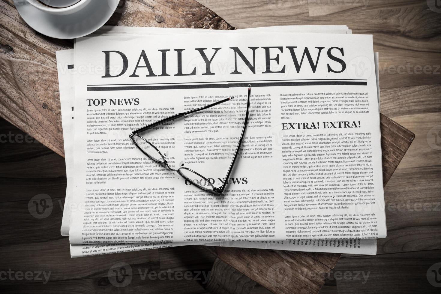 Business Newspaper on wooden desk with glasses and coffee cup, Daily Newspaper mock-up concept photo