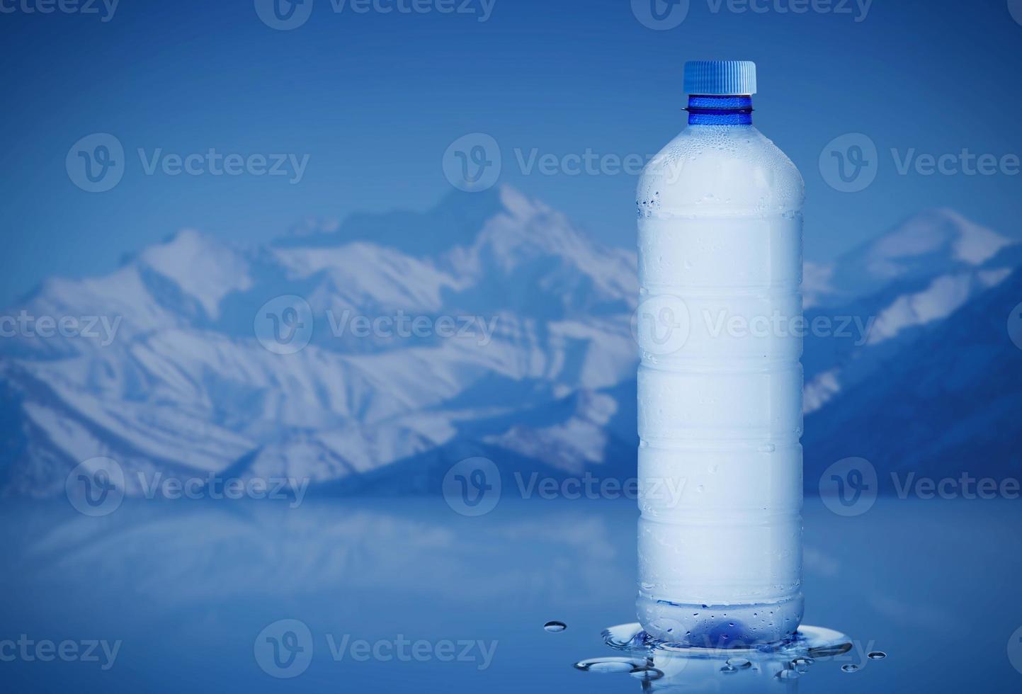 Pure mineral water bottle with water drops in the iceberg background, Healthcare and beauty hydration concept photo