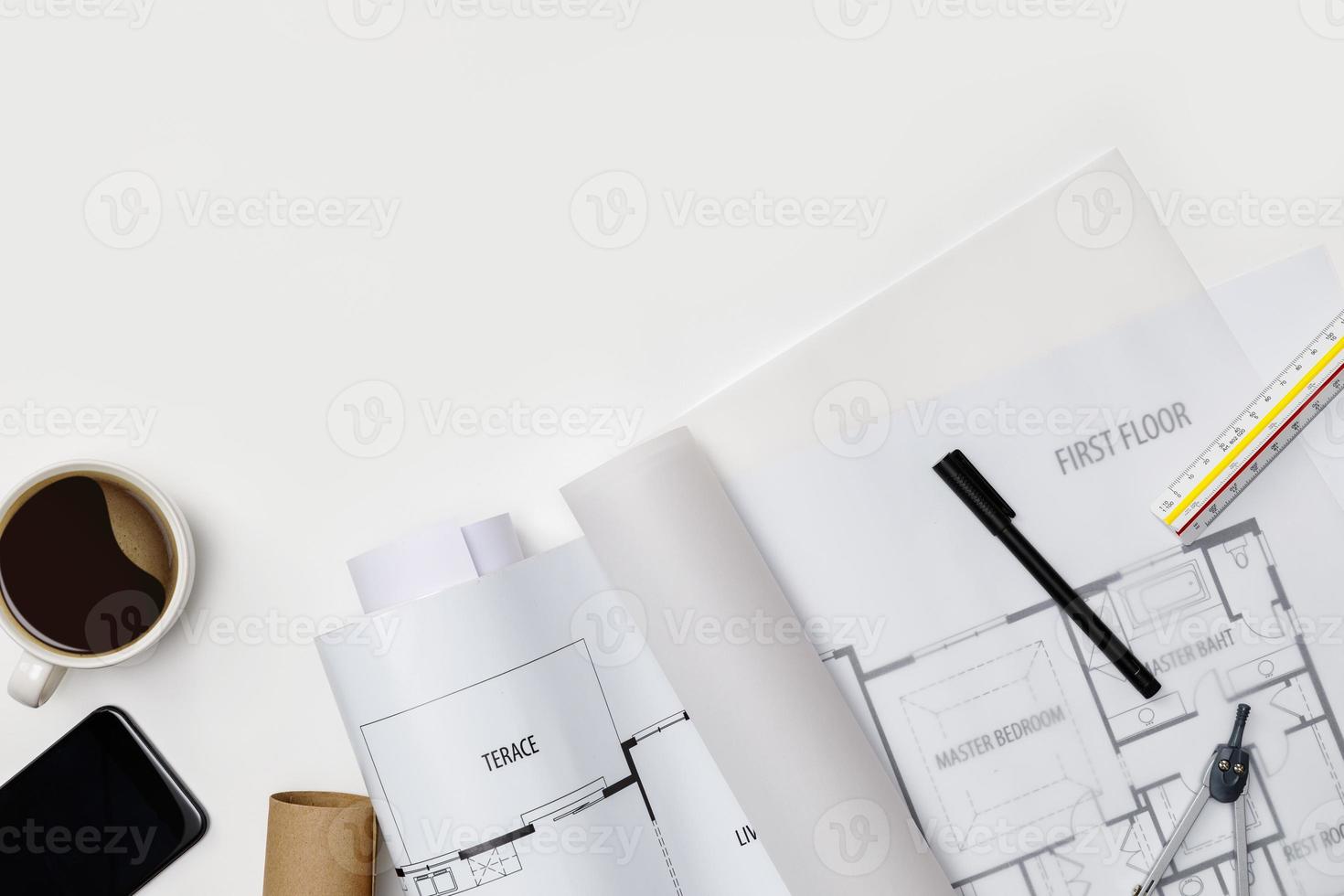 Creative flat lay of architects white table with roll blueprints, architectural project plan, engineering tools, office supplies and a cup of hot coffee,Workspace for designer concept photo