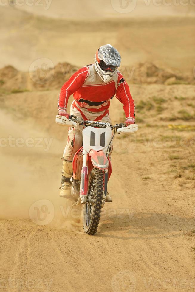 Riding a motocross bike photo