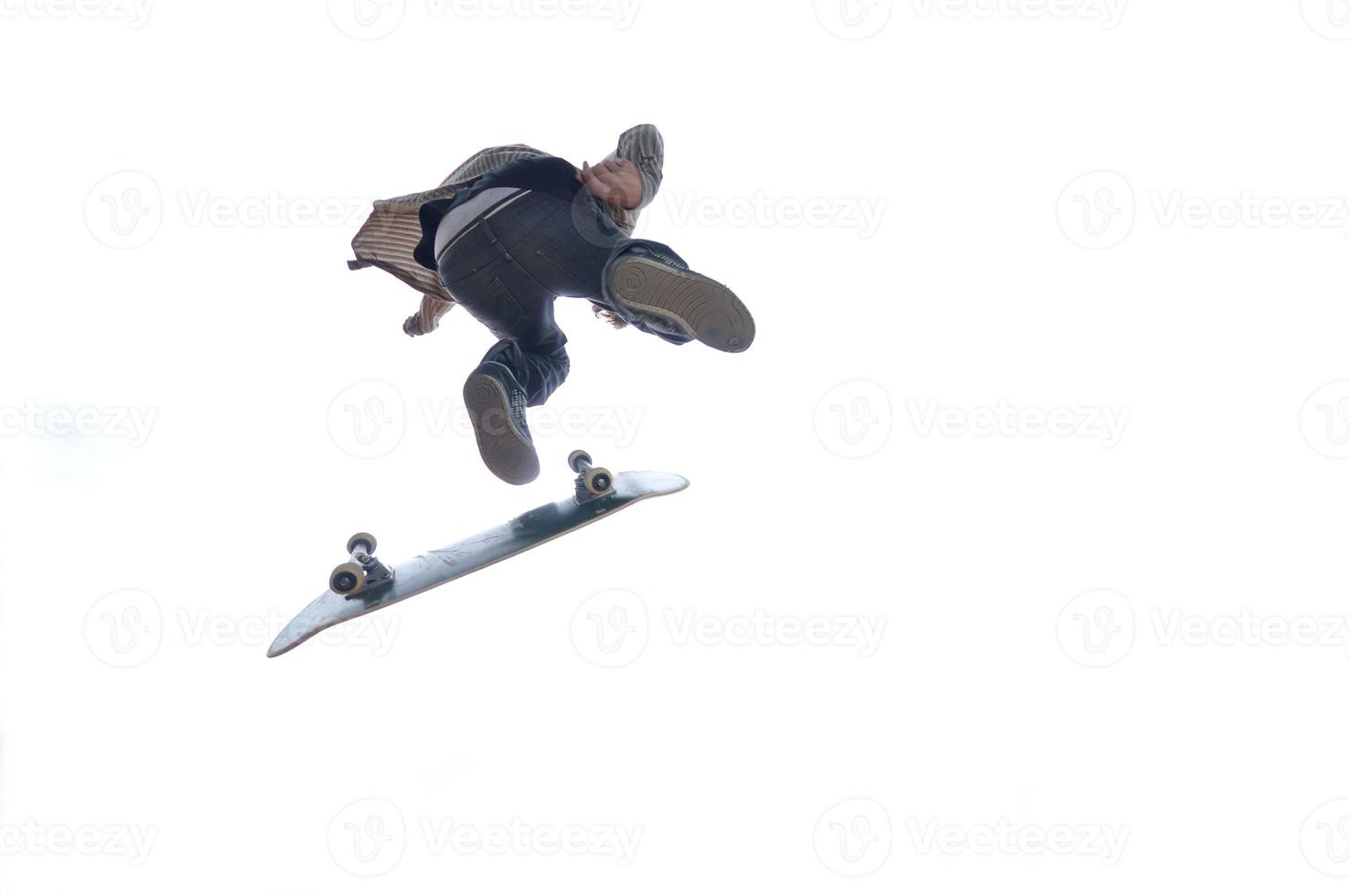 Boy practicing skate in a skate park - isolated photo