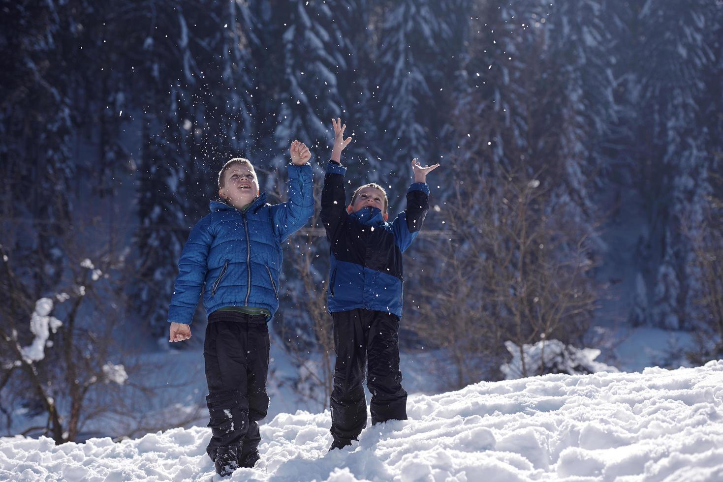 kids playing with  fresh snow photo