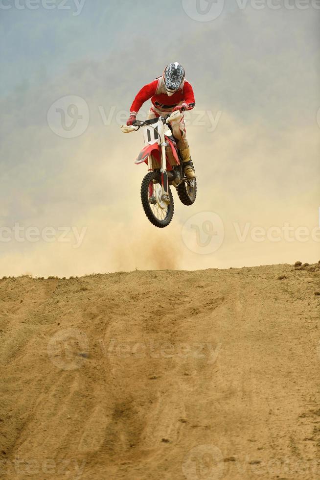 Riding a motocross bike photo