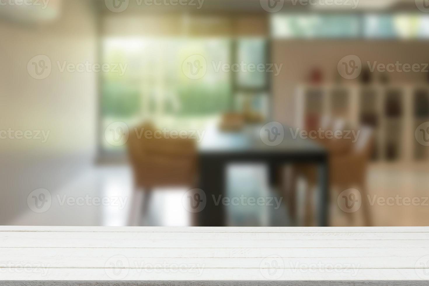 Empty wooden table top with view of office or wooden desk with library room with blur background, copy space for your text photo