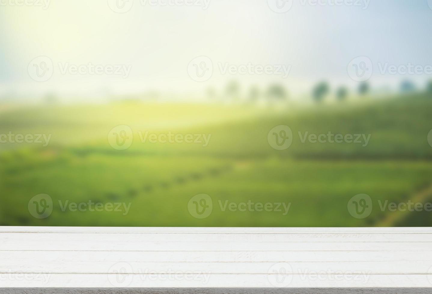 Empty wooden table with view of mountain or wooden desk with plantation nature with bokeh background, copy space for your text photo