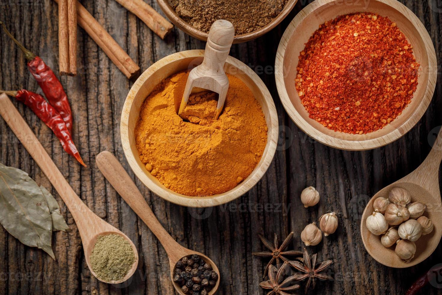 Herbs and spices on the wooden table photo